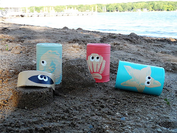 Sea Creature Sand Castle Cans. Just paint the stamps and press them onto the recycled vegetable cans, you can create these funny sand castle scoops easily. They can used to scoop and dig sand and make castles in summer. Or you can place pencils and markers inside for the rest of the year.