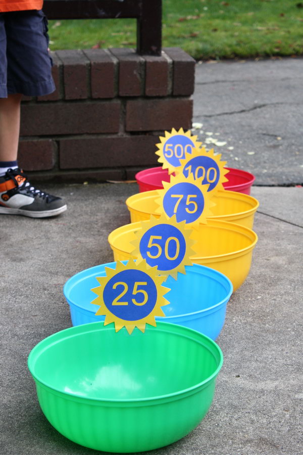 Bean Bag Toss. Place bowls from the dollar bin from target. Ask kids to take turns to throw the bean bags into the bowls. You can specify scores for different bowls and count the winner. It's easy for kids to play in this funny way.