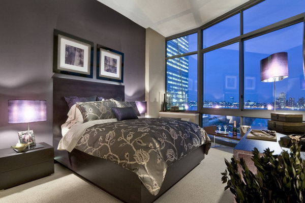  Deep Purple Hue: This deep warm purple shade looks fantastic paired with dark wood tones and light, neutral hues. What made this bedroom standout is the big the wall to wall and floor to ceiling windows. If you have windows like this, you can duplicate this glamorous bedroom.