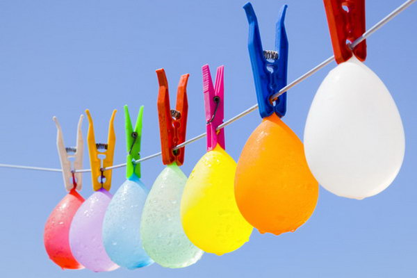 Hanging Colorful Water Balloons. Ask kids to hang water balloons up on the line with the clip. Set the timer to see who can complete this process the first without breaking anyone of them. The kids must feel thrilled to do this and win the champion.