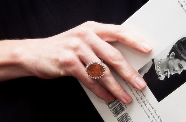  DIY Penny Ring.  Glue rhinestone trim to the edge of the coin and then attached the finished 