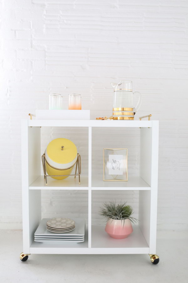 DIY Bar Cart. A Kallex shelving unit and some casters produce a very chic mini cart for all your bartender needs. Come discover Brilliant Ikea Hacks for the Kallax Shelf! #ikea #kallax #ikeahacks #barcart #diy