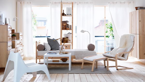 Natural & Restful. In this living room, the combination of natural wood and a neutral color palette creates a welcoming and calming atmosphere for both the family members and visitors. 