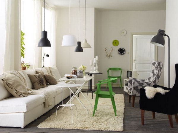 The Combination of Rustic and Modern. In this living room, the dark, rustic flooring contrasts with the lighter tones of the contemporary furnishing and the beige-painted wall. Four small pendant lights really adds more modern feeling to this living space.