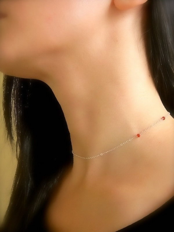 This necklace is so quirky and cool. When you put it on, these two little red crystals look like vampire fang marks!