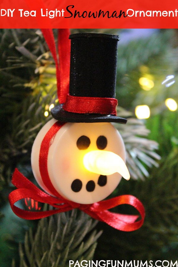 Tea Light Snowman Ornaments. What an easy but cute DIY Christmas craft idea for the frugal gift-givers. Send your neighbors little tea light snowman ornaments to hang on their Christmas trees.  