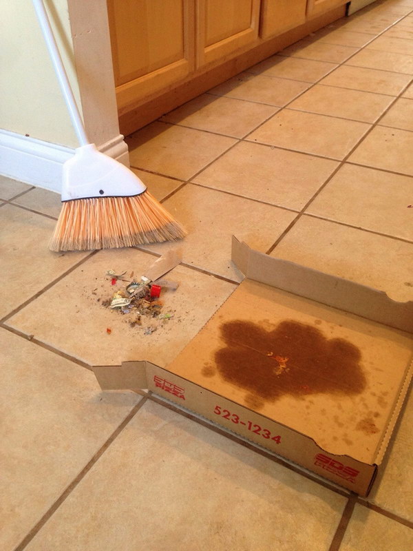 If there is no dustpan in your dorm room, use a Pizza box to serve as a DIY dustpan. 