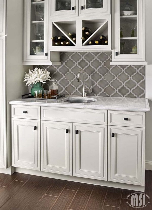 White subway tile backsplash with grey cabinets