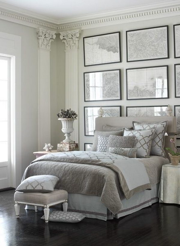 Luxe grey and white bedroom with frame wall decor.