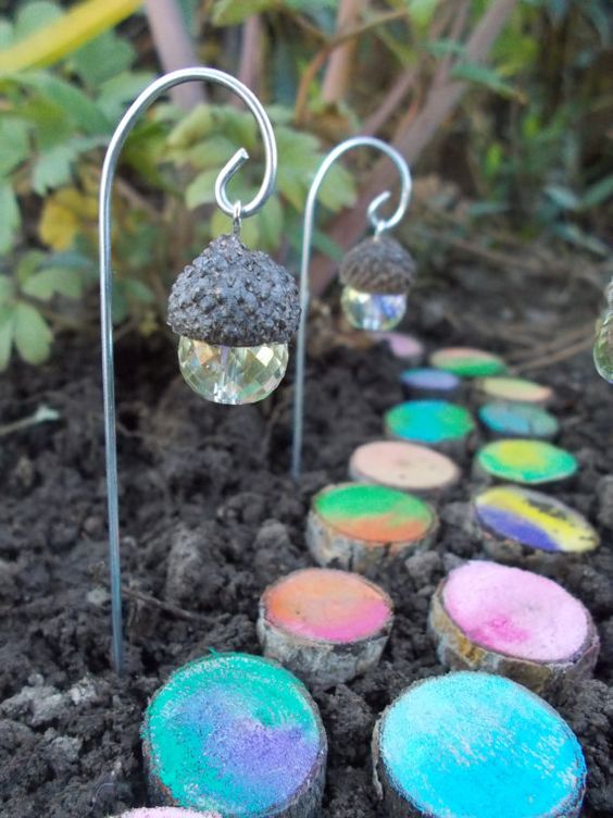 Acorn Lantern with a Painted Log Walkway. 