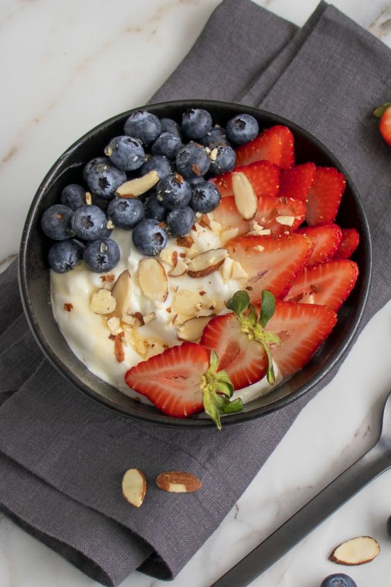 Berry Yogurt Bowl with Honey and Almonds. 