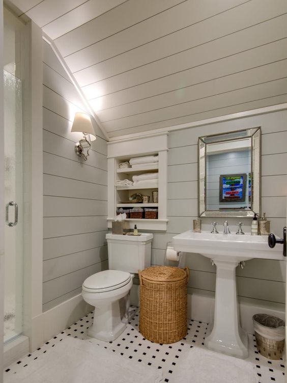 Bathroom With Shiplap Wall And Vaulted Ceiling. 