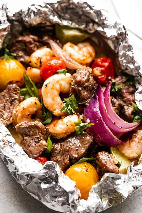 Steak and Shrimp Foil Packets in Oven. 