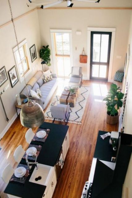 Open Concept Kitchen and Living Room With Sofa. 