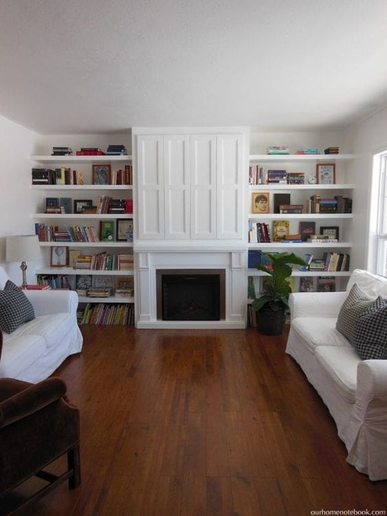 Floor To Ceiling Cabinets Around Fireplace With Hidden TV Nook. 