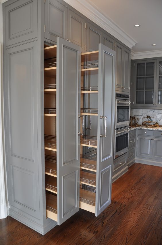 Grey Floor To Ceiling Cabinets With Pull-Out Shelves. 